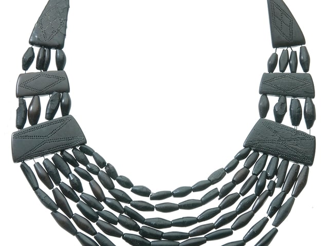 This necklace was found in a burial  near Kilmartin in Argyll. It was an expensive item for ostentatious display. Made from Whitby jet, it was imported from Yorkshire sometime between 2050 and 1800 BC. PIC: NMS.
