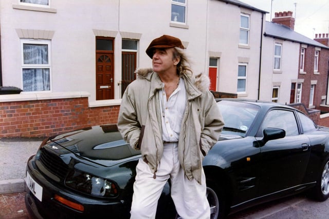 Peter Stringfellow with his Aston Martin pictured outside his old family home, 46 Andover Street, Sheffield, October 1994