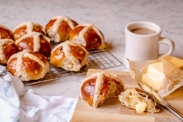 Hot-cross buns

Makes 6 -8 buns

Prep time – 10 minutes

Proving time -40 minutes

Cooking time – 15 minutes

INGREDIENTS

500g – strong flour
½ tsp – salt
2 tsp – mixed spice
50g – golden caster sugar
50g – unsalted butter
225g – mixed dried fruit
1 x 7g – sachet dried yeast
2 – large free-range eggs, whisked
200ml – whole milk
For the crosses

60g – plain flour
To glaze – honey
Method:

Add flour salt, mixed spice and sugar to a bowl and stir.
Rub in the butter with your fingertips.
Stir in the dried fruit, sprinkle over the yeast and mix in.
Warm the milk slightly and mix with the whisked eggs.
Add this mixture to the flour and fruit and combine well until it becomes a loose dough.
Break the dough into 6 – 8 even-sized pieces and place on a lightly floured surface.
Mould them into individual buns and place them on a lined baking tray well apart from each other.
Allow the buns to prove for 30 – 40 minutes until they have grown by about 50%.
Preheat the oven to 200˚C.
To make the crosses mix the flour with a little water to make a paste and add to a piping bag.
Once the buns have risen, carefully pipe the mix to make a cross on each bun.
Bake in the oven for 15 minutes or until risen and golden, remove to a wire rack to cool.
Once the buns have slightly cooled, brush with honey and allow them to cool completely.