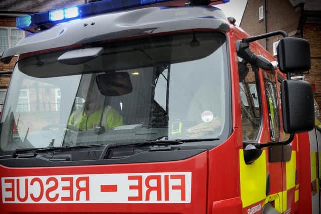 Firefighters from South Yorkshire Fire and Rescue Service rescued an arsonist after she set fire to her former flat.