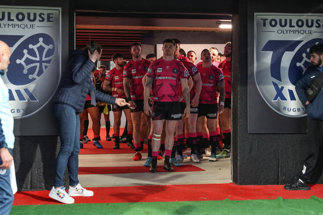 The Wigan Warriors players wait in the tunnel ahead of kick off.