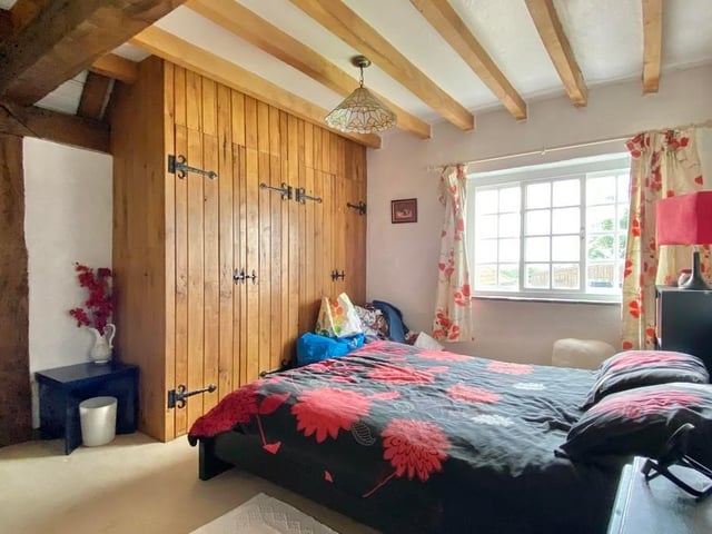 The fourth bedroom includes a window to the back of the property, giving wonderful views over open countryside. The large fitted wardrobes come in handy too.
