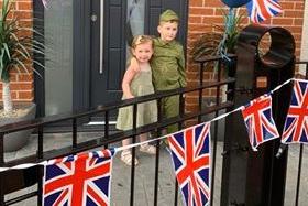 Sister and brother Eliza, two and Carter Sinclair, five, mark VE Day in Rowan Drive, South Shields.