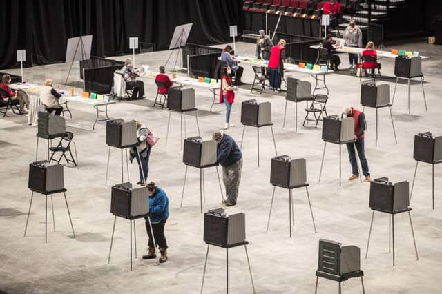 Americans head to the polls on the last day to cast their vote for incumbent U.S. President Donald Trump or Democratic nominee Joe Biden in the 2020 presidential election. (Photo by Scott Eisen/Getty Images)