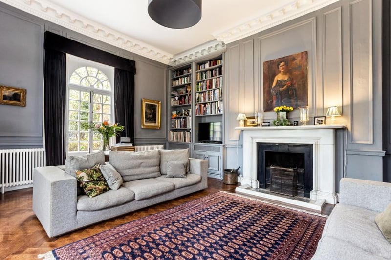 This stylish room has a feature marble fireplace surround with inset open fire
