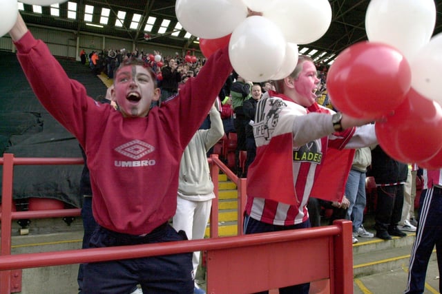 United fans get behind their side against Wednesday at the Lane in December 2000.