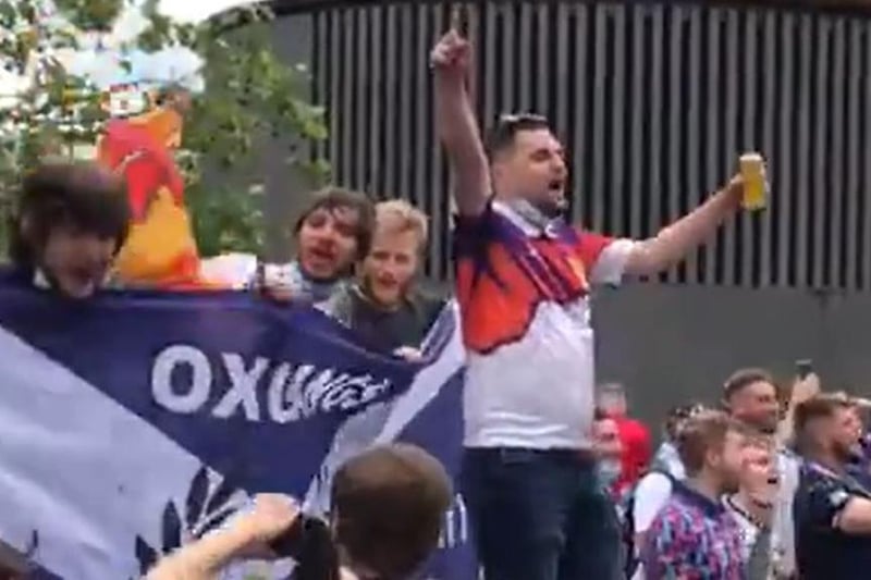 A screen grab from footage taken with permission from the Twitter feed of @SimonLamrock of Scotland fans singing 'Yes sir I can boogie' outside King's Cross St Pancras station, as fans arrive from Scotland for the fixture against England.