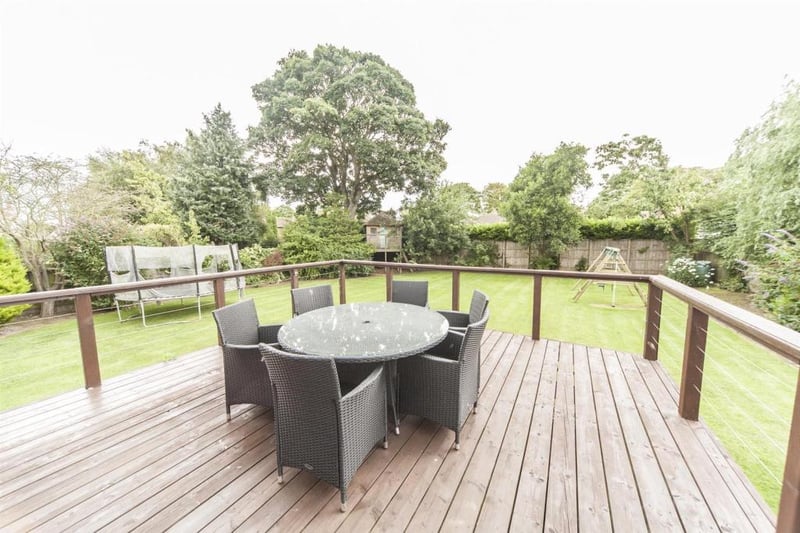 The large south facing garden is complete with a raised decking area.