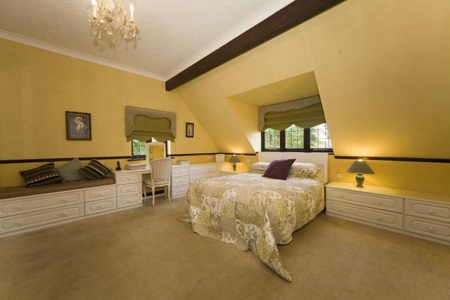 The spacious master bedroom offers fitted wardrobes and an en suite.