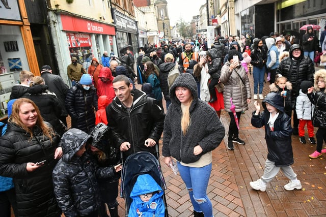 Shoppers gathered in the rain to watch Storm make her way through Falkirk town centre.
