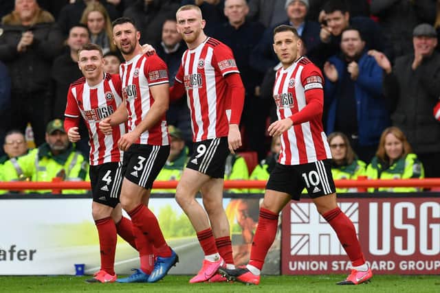 Sheffield United defender Enda Stevens (2nd L) celebrates with teammates after scoring the opening goal of the English Premier League football match between Sheffield United and Brighton and Hove Albion at Bramall Lane (Photo by PAUL ELLIS/AFP via Getty Images)