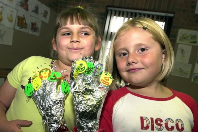 The Woodlands library held an alien at your fingertips themed event in 2002. Pictured are Amelia Goodwin and Abbey Gray with their finger puppets.