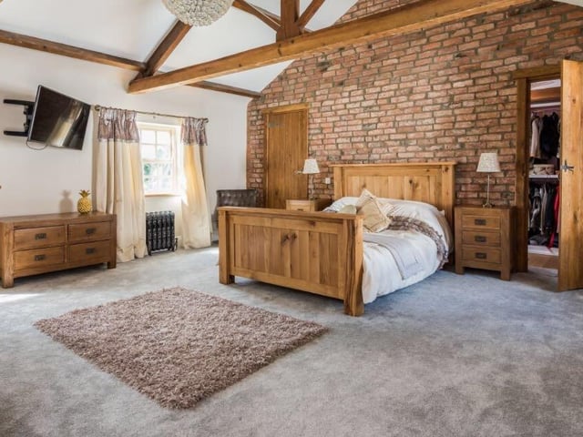 There are five bedrooms in total, including a beautifully furnished master room with an en-suite bathroom, and his and hers dressing rooms.