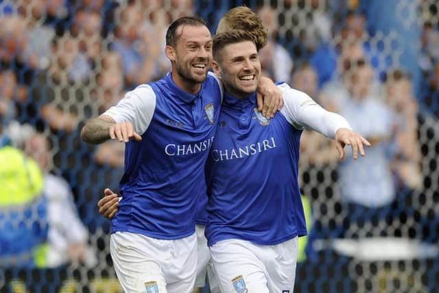 Steven Fletcher celebrates a goal with his former Sheffield Wednesday colleague Gary Hooper.