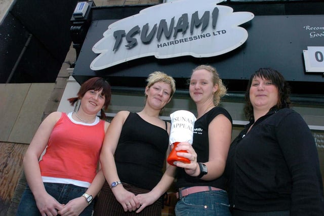 Staff at Tsunami hairdressers raising cash for the Tsunami crisis on Boxing Day 2004, pictured outside the shop in 2005