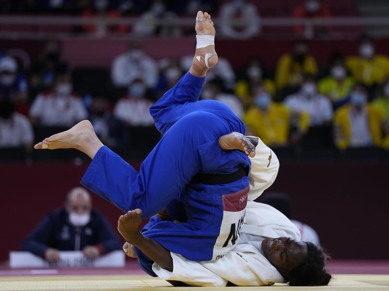 Clarisse Agbegnenou of France, right and Catherine Beauchemin-Pinard of Canada compete in a women -63kg semifinal round of the judo match