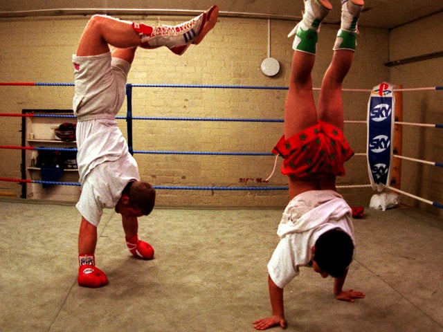 Less than 24 hours since his British light-middleweight title defence, Ryan Rhodes is back in training at the Newman Road Gym where  he  practices some of his party pieces with one of Brendan Ingle's young boxers, 10 years old Kell Brook, February 1997
