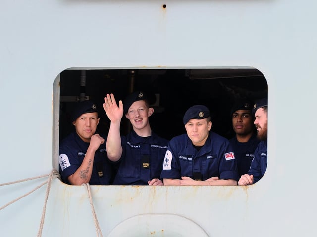 Sailors on HMS Queen Elizabeth as she returns to Portsmouth. Picture: (020720-5215)