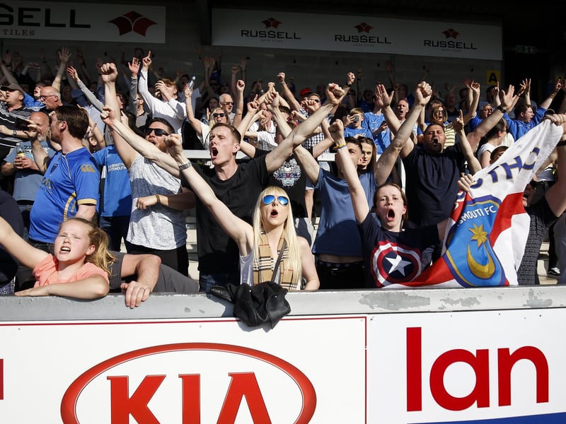Supporters celebrate a 2-1 win at Burton Albion in April 2019.