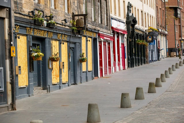 Bars along the Grassmarket are boarded up, and customers have stayed at home.