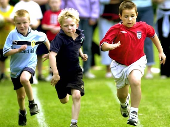 Oughtibridge Sports Day at Coronation Park. Pictured is Joseph Piggott (right) winning the Year 2 sprint (June 2002)