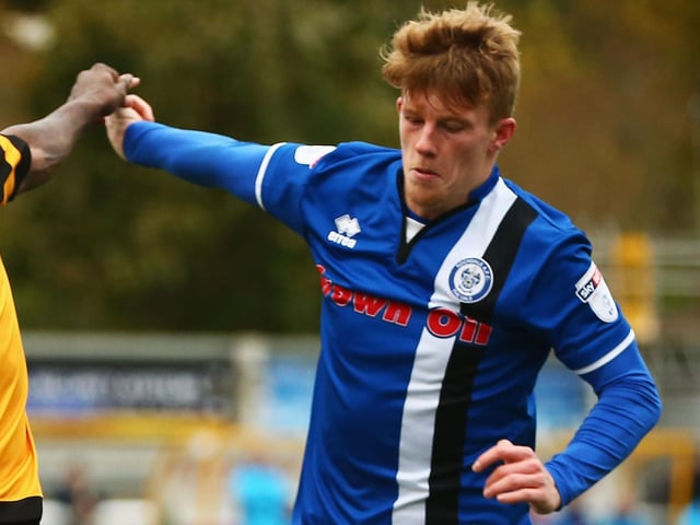 The midfielder in action for Rochdale four years ago. His hair might be this long again during lockdown!