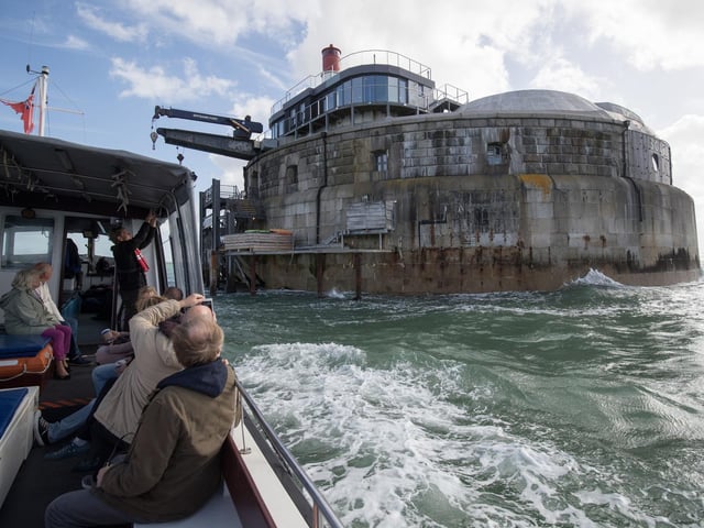 Guests arrive by boat at Spitbank Fort
