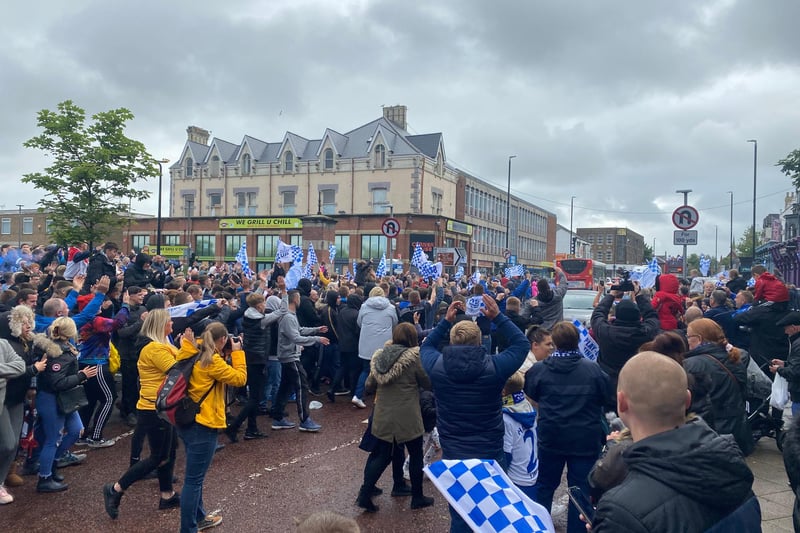 Fans lined the streets of Hartlepool to clap and cheer players following their promotion.