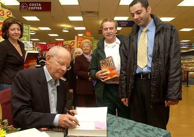 Best selling author Wilbur Smith signs a book for Tariq Malik of Ecclesall at Waterstones, Meadowhall, April 5, 2005