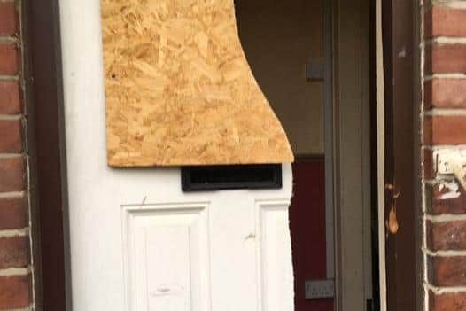The door of the property was battered down by police.
