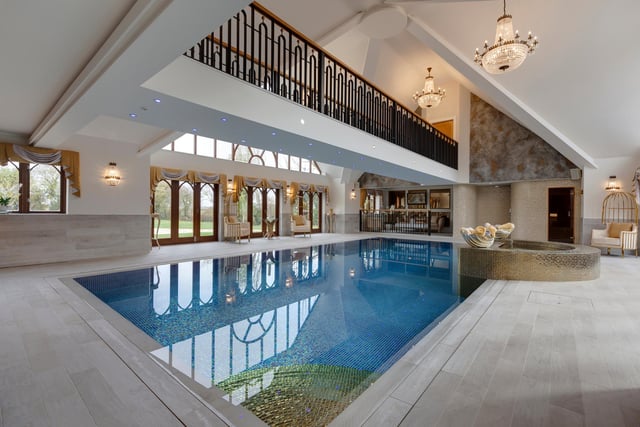 The swimming pool forms part of the property’s spa complex, which includes an indoor heated pool, Jacuzzi, sauna, relaxation area, shower rooms and a suspended walkway above the pool which leads to a treatment room.