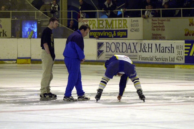Paul Thomson (centre), coach of Coventry Blaze, and a Fife Flyers player inspect the damage to the ice (Pic: Bill Dickman)