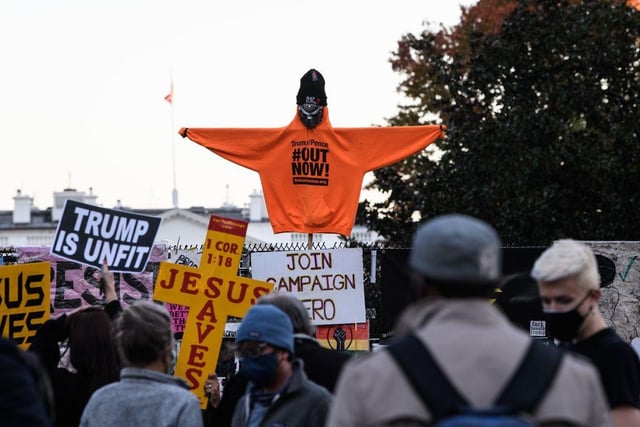 Demonstrators rally near the White House in Washington, DC.