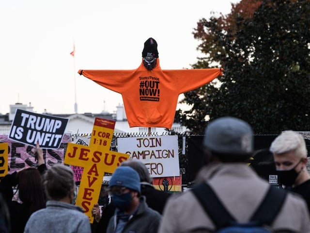 Demonstrators rally near the White House in Washington, DC.