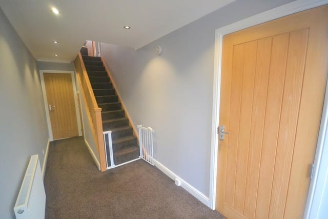 Entrance Hall - A spacious and well presented entrance hall with an Oak staircase rising to the first floor. Matching internal Oak doors open to the kitchen, garage and a useful under stairs storage cupboard.