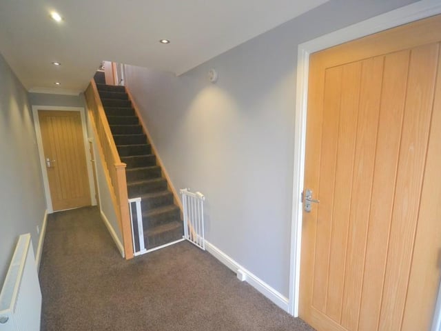 Entrance Hall - A spacious and well presented entrance hall with an Oak staircase rising to the first floor. Matching internal Oak doors open to the kitchen, garage and a useful under stairs storage cupboard.