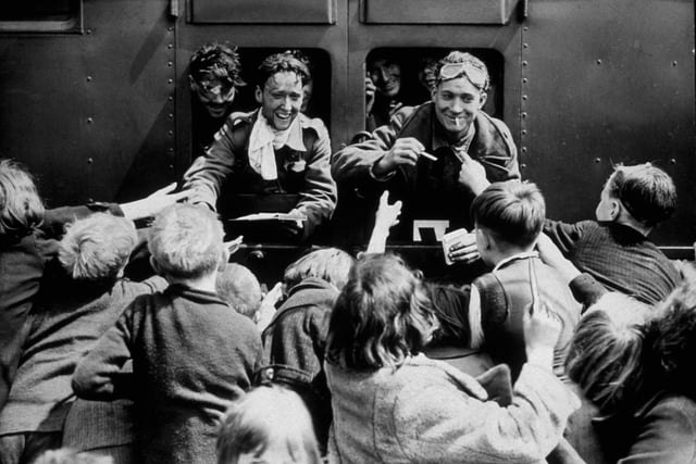 Children rush up to a train carrying Troops of the British Expeditionary Force (BEF), who have been repatriated in the Dunkirk evacuation, 26th May - 4th June 1940. (Photo by Hulton Archive/Getty Images)