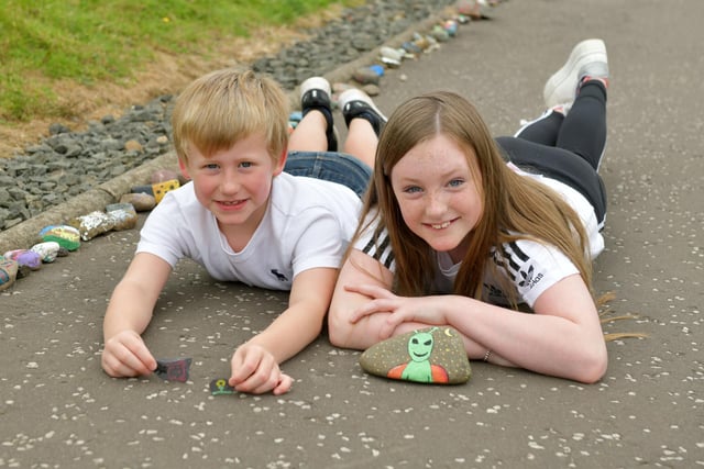 Josh Murray 6 and Lucy Murray 10 started a lockdown caterpillar in Redding inviting people to paint stones and add them.