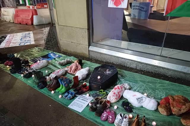 Shoes placed outside Barclays Bank in Sheffield city centre to symbolise the thousands of children who have been killed in Gaza by Israeli airstrikes and ground offensives. Picture: Jon Cowley