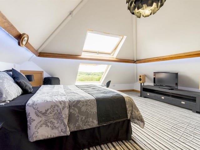 The master bedroom on the first floor has a en-suite and a landing which is currently used as an office.