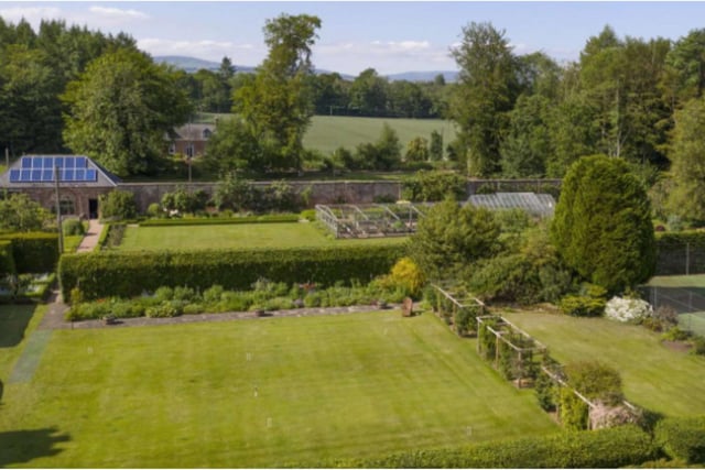 The formal gardens include a paved terrace, richly planted herbaceous borders, roses and expanses of lawn including directly in front of the castle.