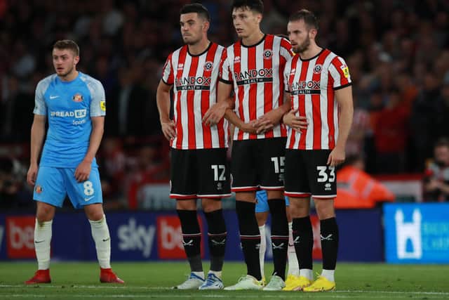 John Egan, Anel Ahmedhodzic and Rhys Norrington Davies are expected to anchor Sheffield United's defebce at Luton Town: Simon Bellis / Sportimage