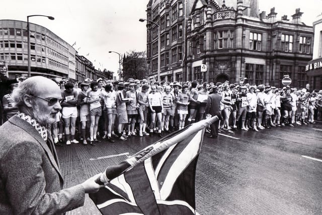 Mr Colin Brannigan, the Editor of The Star, flagging off the 1977 Jubilee Star Walk in High Street, Sheffield on 7th June 1977