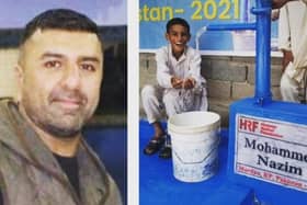 Naz Khan, whose real name is Mohammed Nazim, and one of the water pumps installed in his memory