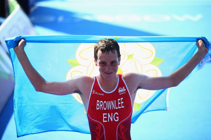 Alistair Brownlee of England crosses the line to win gold in the Men's Triathlon at Strathclyde Country Park during day one of the Glasgow 2014 Commonwealth Games on July 24, 2014.
