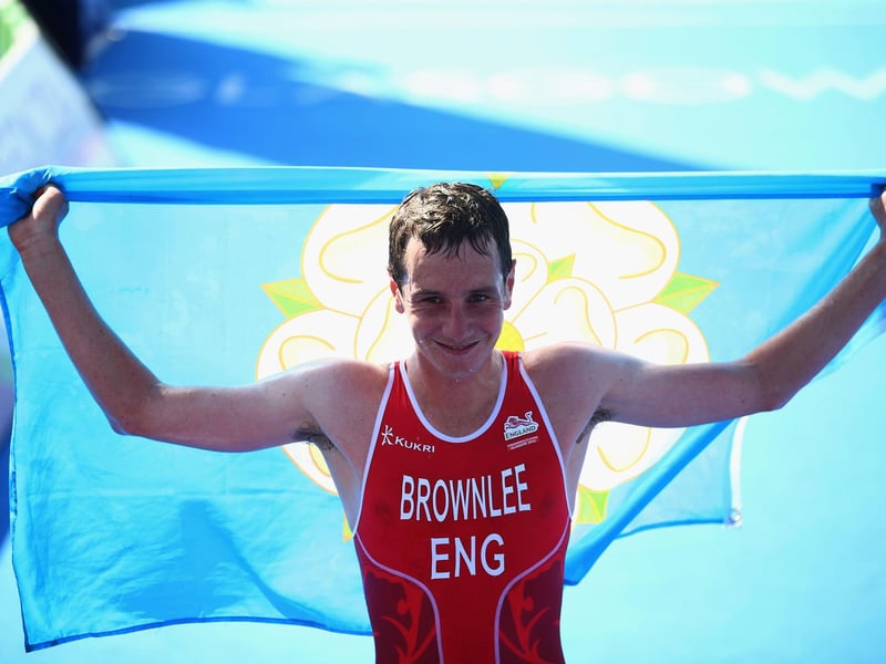Alistair Brownlee of England crosses the line to win gold in the Men's Triathlon at Strathclyde Country Park during day one of the Glasgow 2014 Commonwealth Games on July 24, 2014.