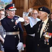 One of Sheffield's last remaining Normandy Veterans from World War Two, Cyril Elliott, accepts a toast from the Lord Lieutenant of South Yorkshire, Dame Hilary Chapman