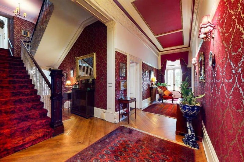A grand entrance welcomes guests in this grand home.