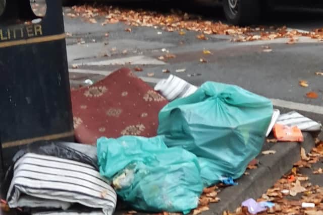 Rugs and food waste have been dumped near bins in the area over the last eight weeks.