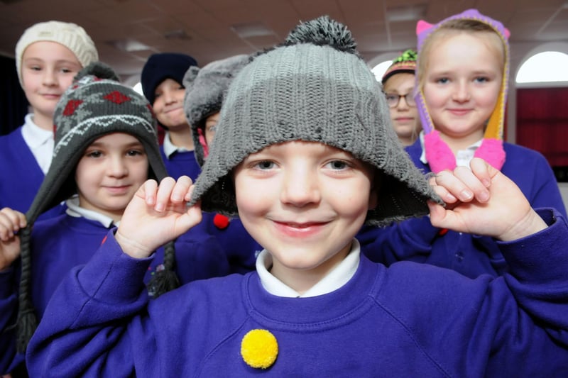 A 2014 retro photo showing Ridgeway Primary School pupils wearing woolly hats in support of Age UK's Bobble Campaign. Does this bring back happy memories?
